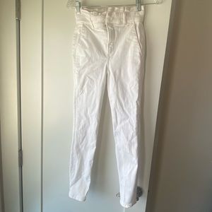 Super high waisted white skinny jeans with ruffle top.